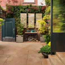 Potted Plants and Vertical Containers Define This Lush Courtyard 