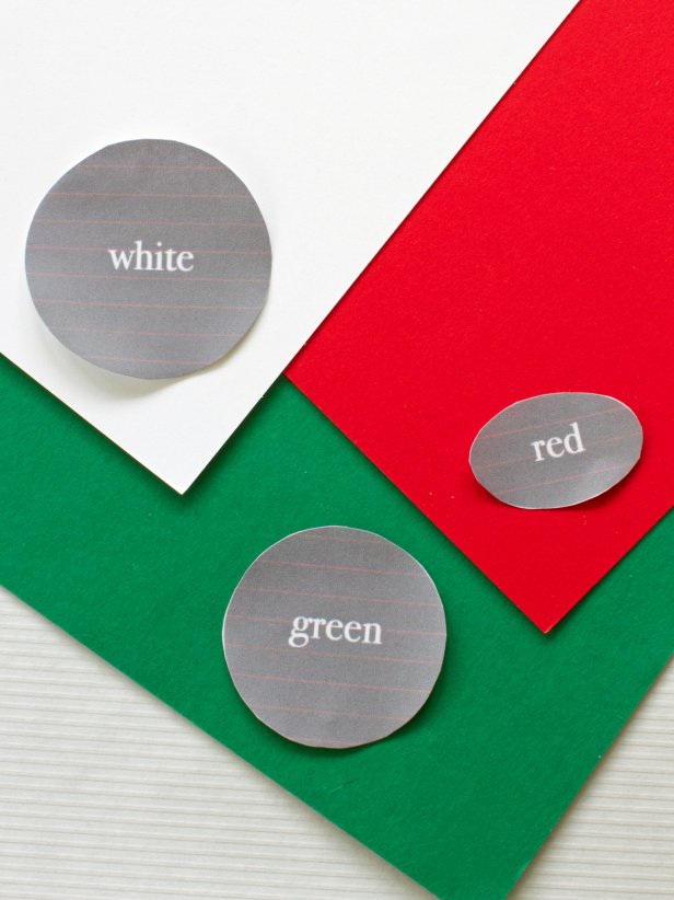 Cut out the circles on the template attached to this HGTV.com article and use them to create three small circles out of red, green and white construction paper to create a pheasant face for Thanksgiving place cards.