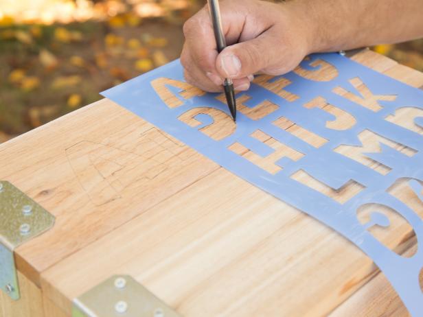Stenciling Letter on Wood Crate With Pencil