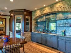 Rustic Wet Bar with Blue Cabinetry and Stone Surround