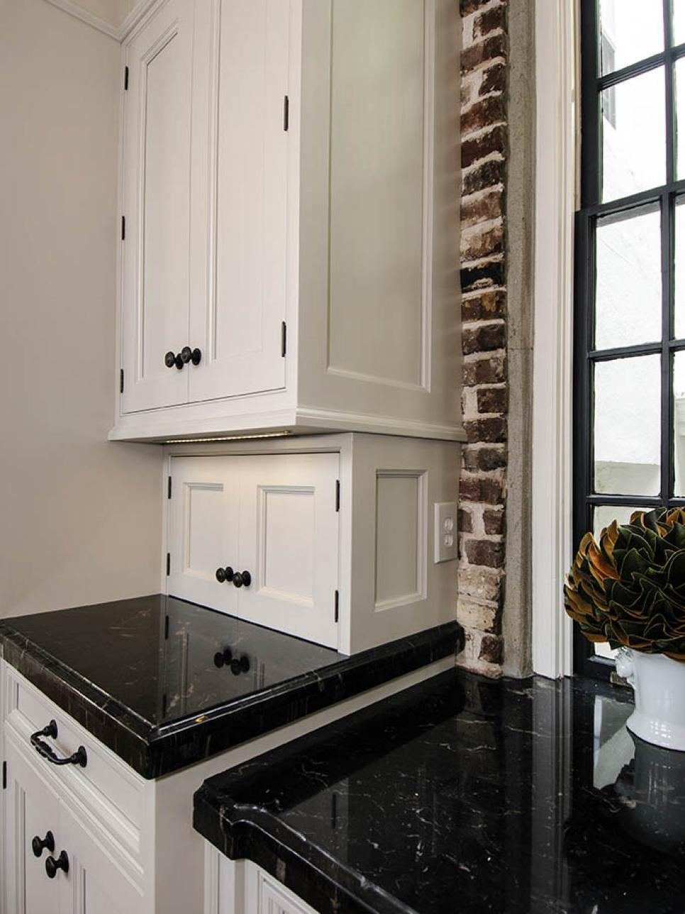 Traditional Kitchen with White Cabinets and Brick Walls | HGTV