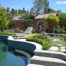 Tile Swimming Pool Surrounded by Landscaping