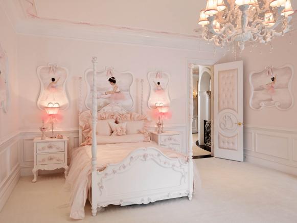 Pink Girls' Bedroom With White Poster Bed and Chandelier