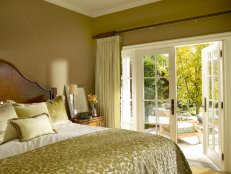 Yellow Bedroom With French Doors Onto Patio