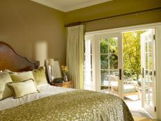 Yellow Bedroom With French Doors Onto Patio