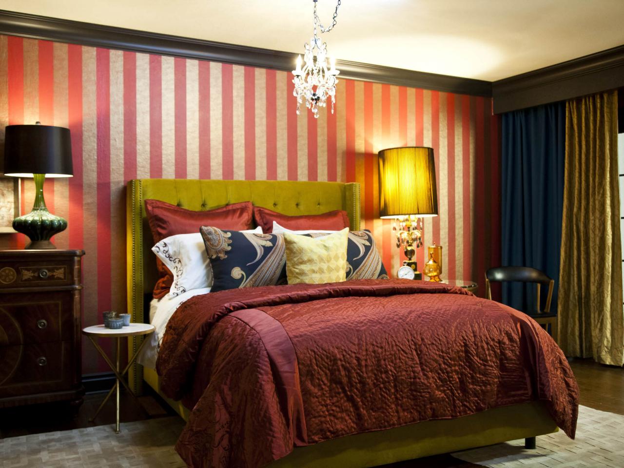 Bedroom With Red And Gold Striped Wall And Chandelier Hgtv