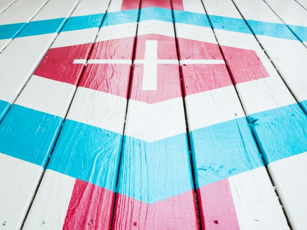 Liven up a deck by painting it bright colors, adding a graphic pattern, or both!