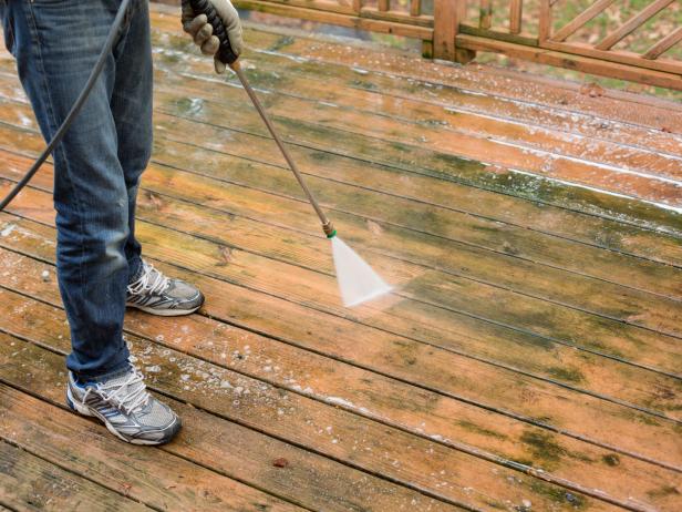 Remove any top layer of grime, mildew or moss from surface of deck using pressure washer.