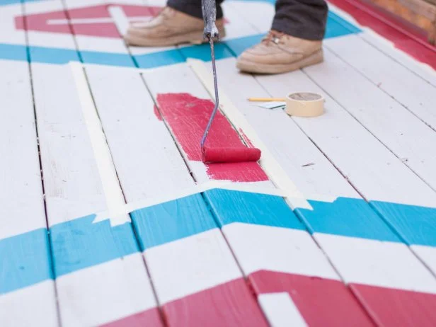 Fill in the taped off areas with accent color using roller. Use an angled paint brush to paint the edges and in-between cracks.