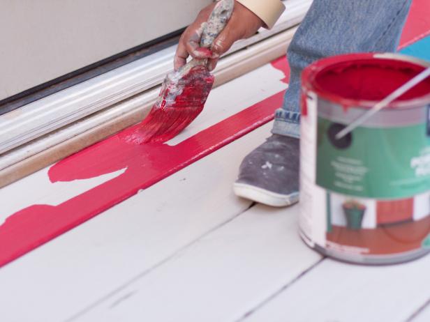 Use a 3-inch angled paintbrush to paint the edges and in between cracks.