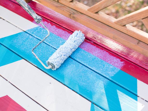 In step 12 of this project, once additional layers have dried, remove painters tape, and protect the paint from the elements by rolling waterproof sealant over entire surface of the deck.