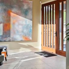 Transitional Entryway with Colorful Artwork