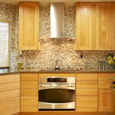 Modern Kitchen With Wood Cabinets and Mosaic Backsplash
