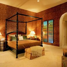 Traditional Bedroom With Black Canopy Bed and Red Wallpaper