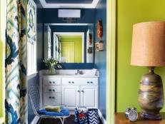Blue Powder Room With White Vanity and Metal Wire Chair
