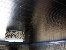 Tongue and groove wood ceiling with gold accented light