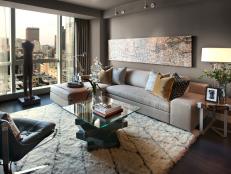 The living room showcases locally sourced furnishings and art and offers breathtaking views of Boston's Public Garden, Beacon Street and Charles River.