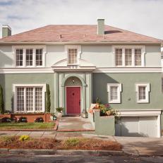 Green Stucco Home Exterior With Red Door