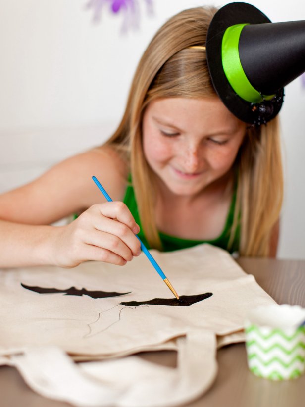 Using a small paintbrush, outline the design then fill it in with water-based craft paint.