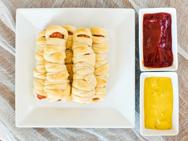 Wrap hot dogs in flaky, ready-made dough to create a Halloween snack kids will love to gobble up.