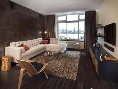 Living Room With White Sofa, Glass Coffee Table and Gray Slate Wall