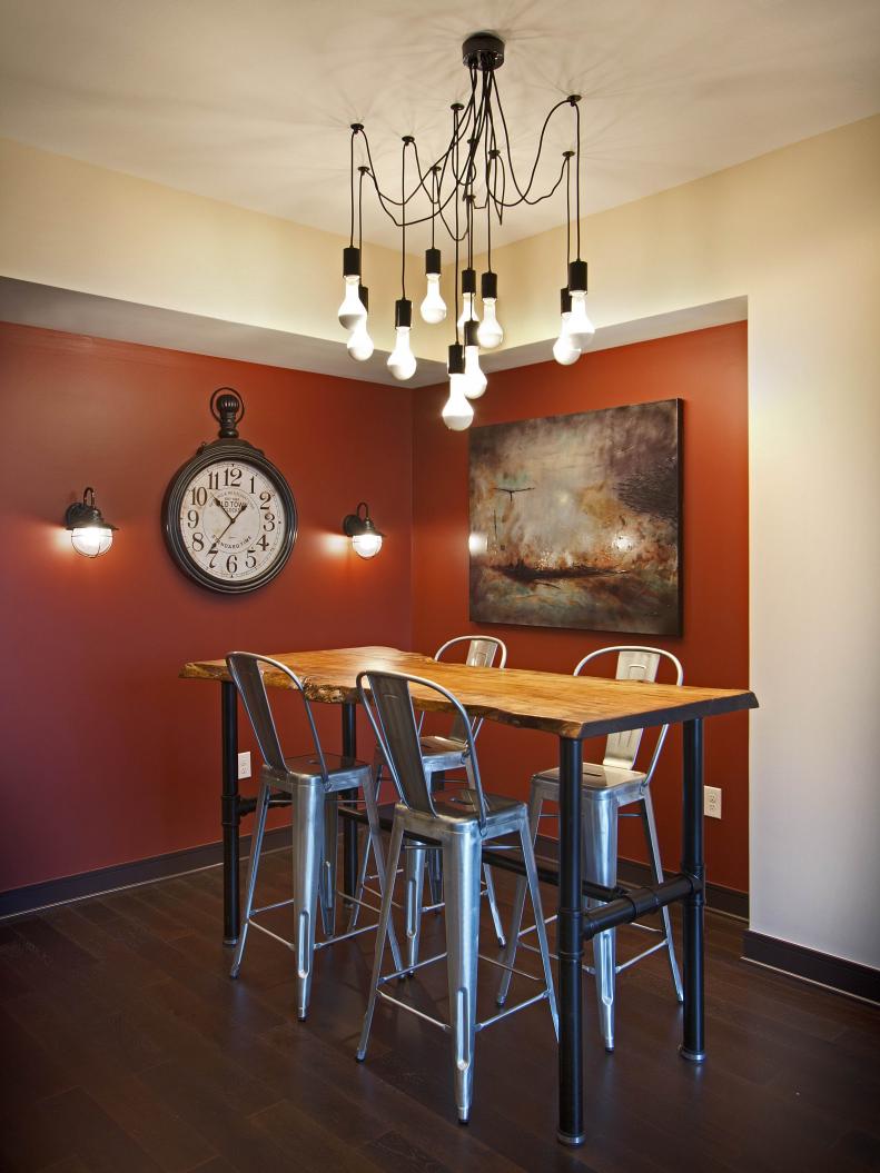Red Dining Room With Rustic Wood Table and Industrial Metal Barstools
