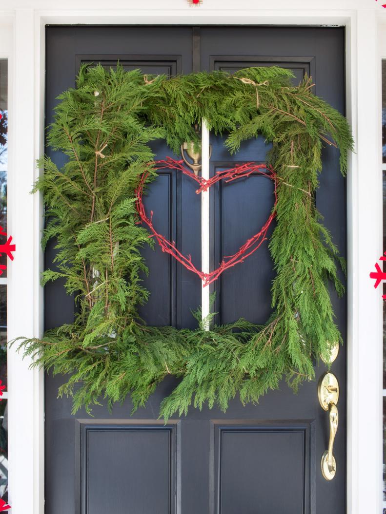 Greet holiday guests with a square tree cutting hung along the front door.