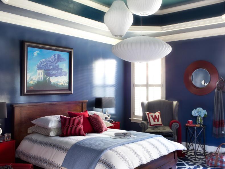 Blue Eclectic Master Bedroom With Red Accents and White Bedding