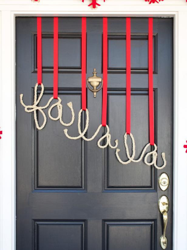 Black Door With Rope Hanging From Red Ribbon