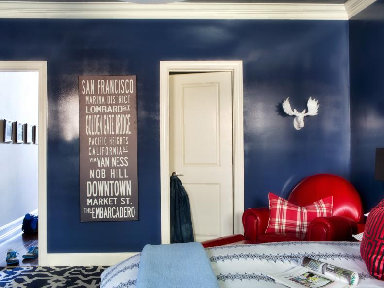 Eclectic Blue Bedroom With Red Armchair