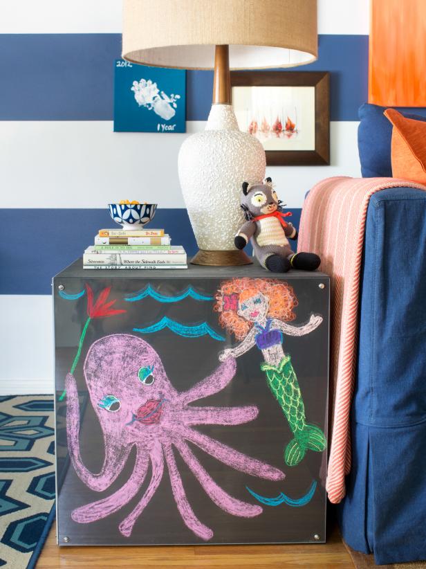 A touch of playfulness was added to the family room's furnishings with chalkboard cube end tables that flank each of the slipcovered sofas. Basic wood cube tables are painted with chalkboard paint, then covered with acrylic panels to keep designs sharp and furniture clean.