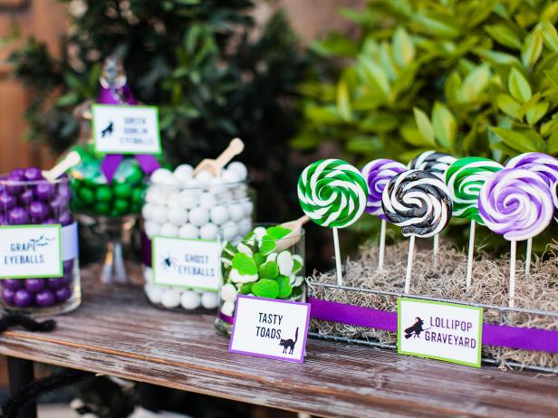 Get creative with your Halloween party candy and treats by displaying them in various ways. Jars in variety of sizes, candy cups and embellished bags are all great choices!