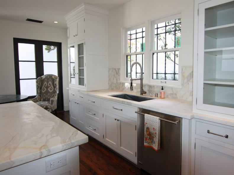 White Cottage Kitchen With Calacatta Marble Countertops 