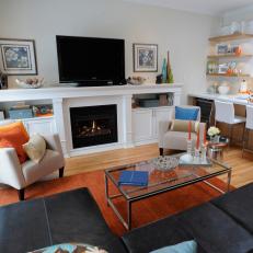 Family Room With Orange Rug and Leather Sofa