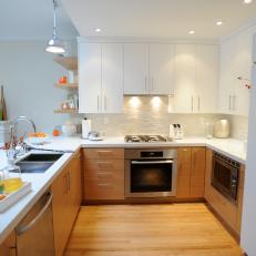 Contemporary White Kitchen With Tile Backsplash