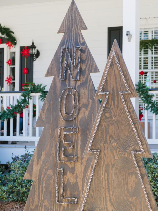 Make a rustic and modern statement in your front yard with Christmas tree silhouettes made from plywood and nail heads.