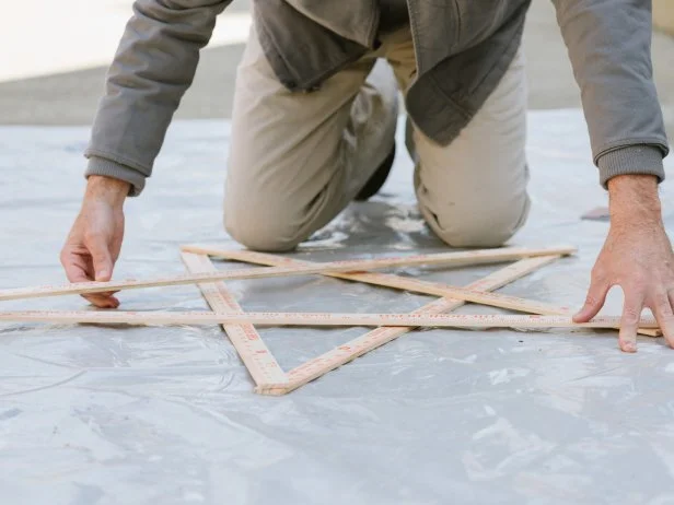 Man Creating Star With Yardsticks