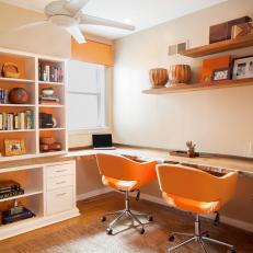 Contemporary Home Office With Wood Desk and Orange Accents