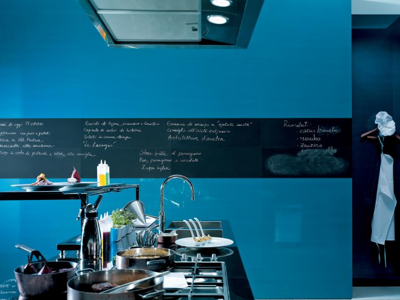 Cluttered Countertop With Double Sinks, Black Stripe on Blue Wall