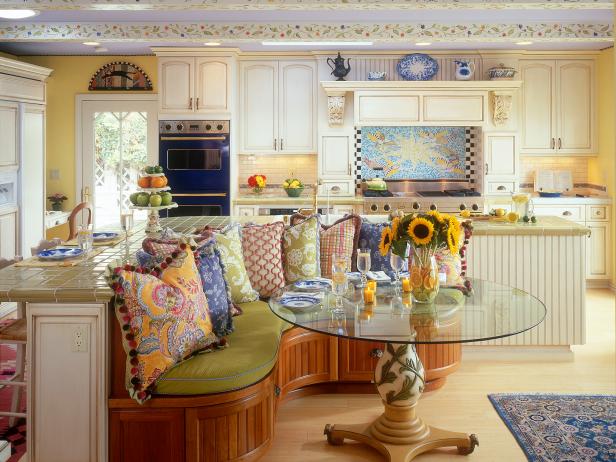 Yellow French Country Kitchen With Colorful Banquette Area | HGTV