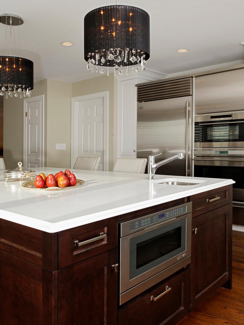 Neutral Kitchen With Large Wood Island With Black Drum Pendants 