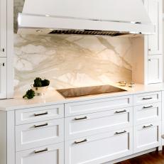 Contemporary White Kitchen Cabinets with Marble Backsplash