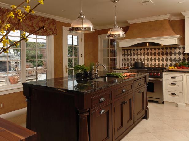Traditional Kitchen With Dark Wood Island and Metal Pendant Lights