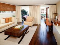 Designer Sarah Barnard relied on vibrant orange hues and outdoor elements give this typical basement a light and airy vibe.