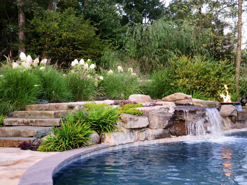 Swimming Pool With Stone Accents and Waterfall 