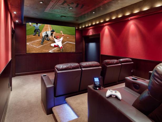 Red Home Theater With Leather Seats and Theater-Style Lights