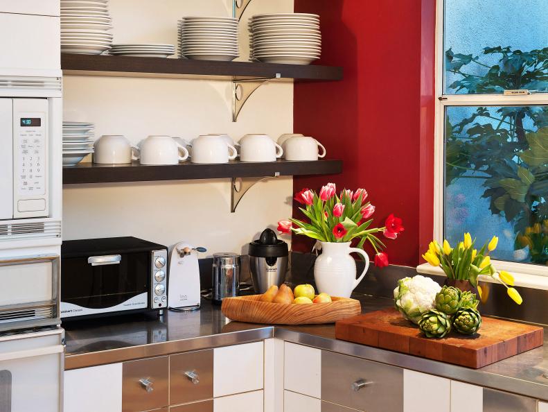 Red kitchen with stainless steel countertops