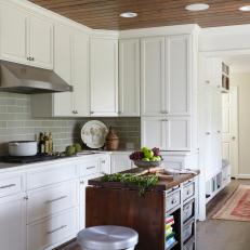 White Cottage Kitchen With Wood-Paneled Ceiling 