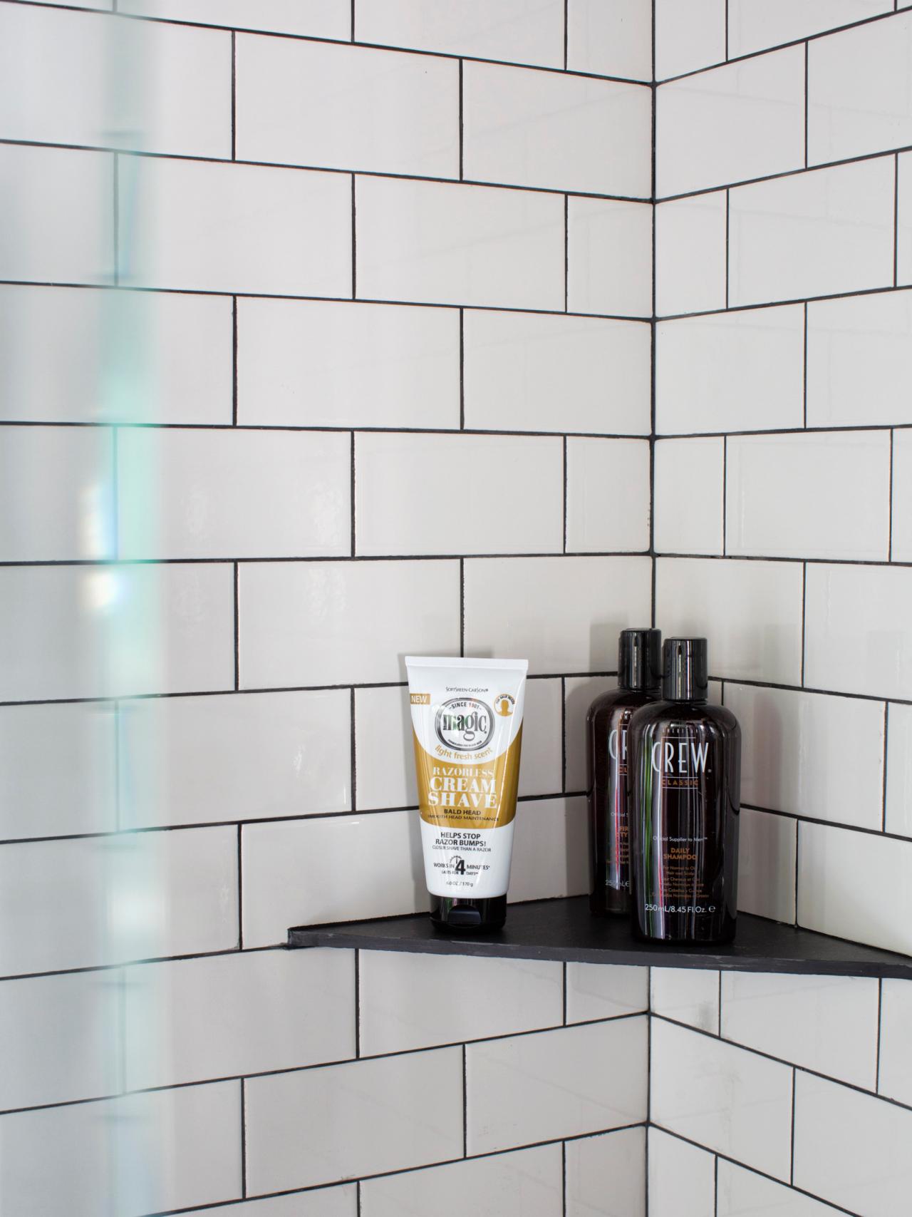 Corner shelves with subway tile in shower and white grout.  Shower corner  shelf, Amazing bathrooms, Bathroom corner shelf