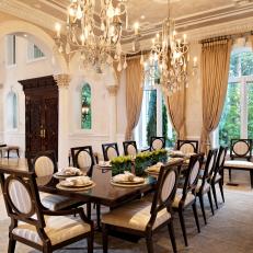 Opulent Dining Room With Double Chandeliers